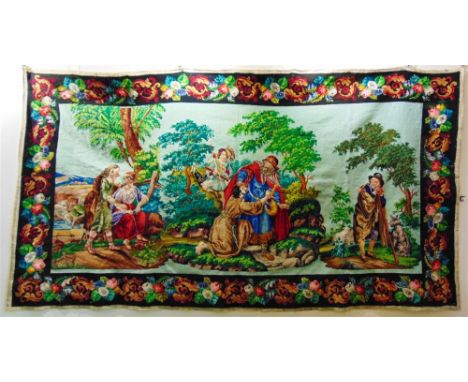 A LARGE WOOLWORK HANGING TAPESTRY PANEL 19th Century Biblical study, good strong colours with floral decorated borders, 120cm