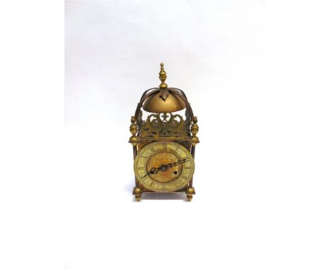 AN EARLY 20TH CENTURY BRASS CASED LANTERN CLOCK with Junghaus movement, 36cm high, 17cm wide