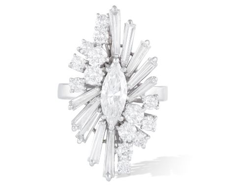 A DIAMOND COCKTAIL RING, CIRCA 1960The elongated marquise-shaped weighing 0.73cts within a surround of round brilliant and ta