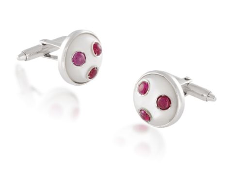 A PAIR OF MOTHER-OF-PEARL AND RUBY CUFFLINKSSingle-sided, each circular bombé mother-of-pearl plaque set with round-shaped ca