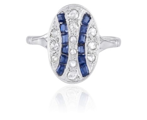 A SAPPHIRE AND DIAMOND RING, CIRCA 1915Designed as an oval-shaped plaque set with rose-cut diamonds and calibré-cut sapphire 