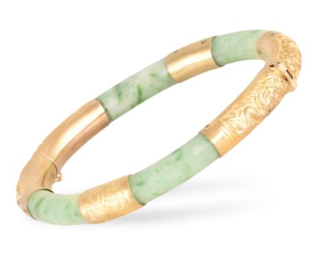 A JADEITE JADE AND GOLD BANGLEThe hinged green jadeite jade bangle accented by panels of engraved foliate and dragon design, 