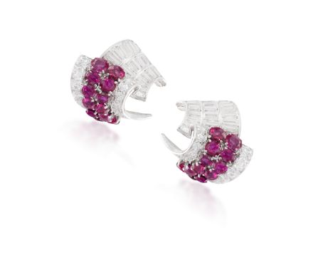 A PAIR OF RUBY AND DIAMOND EARRINGS, CIRCA 1950Each of stylised scroll design, with circular-cut ruby and diamond highlights 