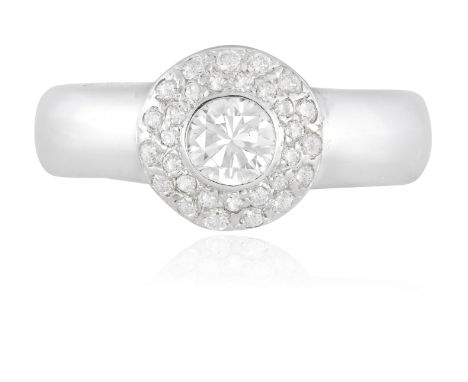 A DIAMOND RINGThe collet-set round brilliant-cut diamond weighing approximately 0.40ct within a surround of brilliant-cut dia