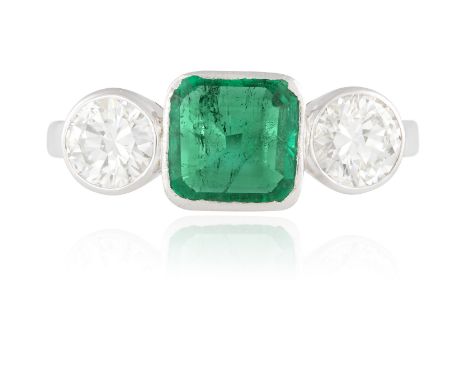 A THREE-STONE EMERALD AND DIAMOND RINGThe octagonal-shaped emerald weighing approximately 1.30cts, between two round brillian