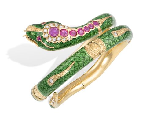 A GOLD, ENAMEL, RUBY AND DIAMOND SERPENT BRACELETDesigned as a stylised coiled serpent applied with guilloché green enamel, t