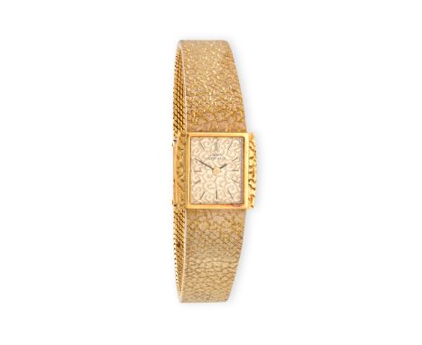 A LADY'S GOLD MANUAL WIND BRACELET WATCH, BY GIRARD-PERREGAUX, CIRCA 1970 17-jewel manual wind movement, patterned champagne 