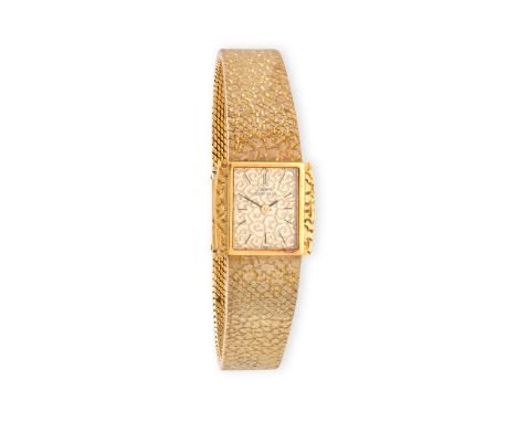 A LADY'S GOLD MANUAL WIND BRACELET WATCH, BY GIRARD-PERREGAUX, CIRCA 1970 17-jewel manual wind movement, patterned champagne 