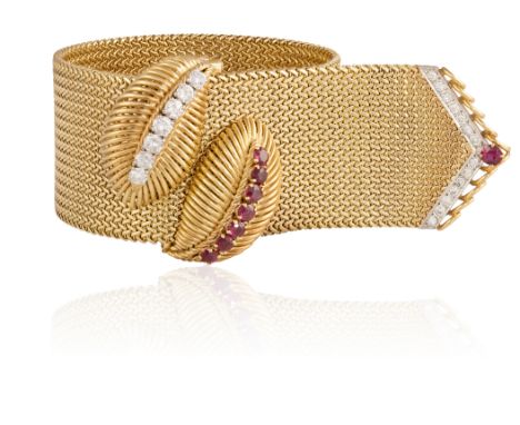 AN ELEGANT MID-20TH CENTURY RUBY AND DIAMOND JARRETIERE BRACELET, CIRCA 1965Designed as a woven strap, the clasp set with two