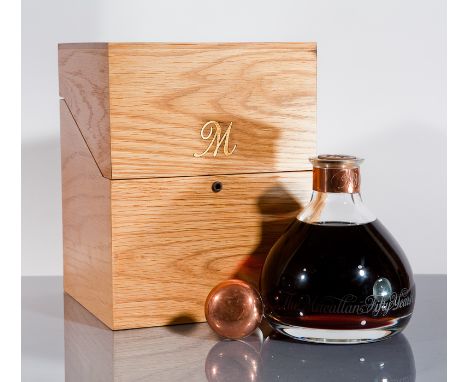 THE MACALLAN MILLENNIUM DECANTER 
Single Highland malt whisky, filled into Spanish Oak Sherry casks in January 1949, released