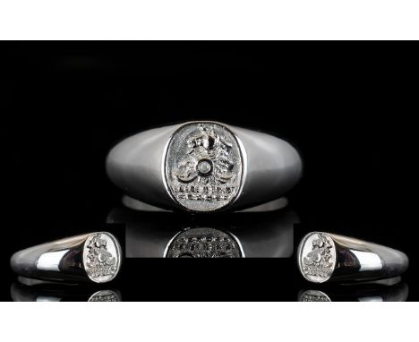 Platinum Signet Ring Raised crest to front set with single diamond, fully hallmarked, ring size, Q, weight 12.7 grams.