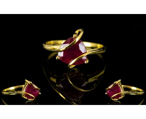 Ruby Trillion Cut Caged Ring, a trillion cut, rich red ruby of 3.25cts 'held' by two strands of the 14ct gold vermeil and sil