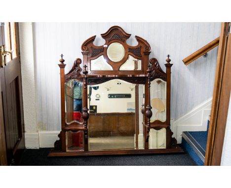 Ornate Over Mantle Mirror fitted with bevelled glass panels, carved curlicue corner detail and four turned pillars with finia