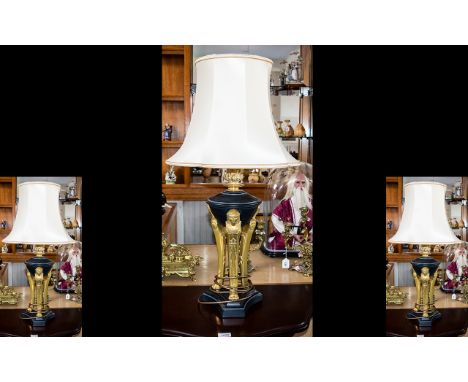 Three Contemporary Neoclassical Style Table Lamps Each raised on black trefoil base with lamp form terminals and brass caryat