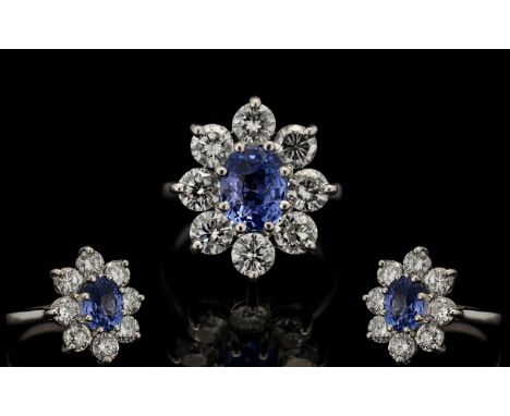 A Top Quality 18ct White Gold Sapphire And Diamond Set Cluster Ring Flowerhead design the diamonds of  estimated G-H colour, 