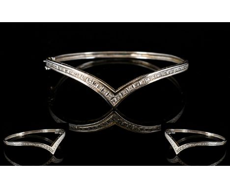 A 9ct White Gold Hinged Bangle Wishbone form set with 25 round cut diamonds, fully hallmarked, 10.6 grams total weight