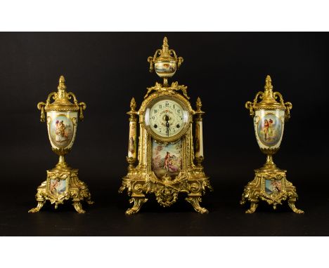 Franz Hermle &amp; Sons Garniture Set Comprising mantle clock with figural transfer printed image on the front plaque, two co