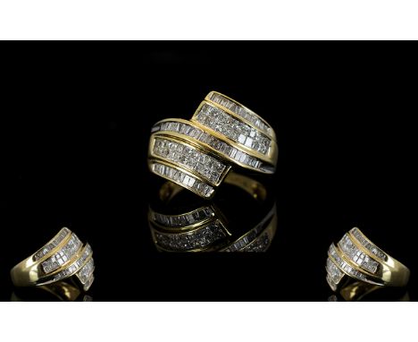 14ct Gold Diamond Dress Ring Comprising seven rows of baguette and princess cut diamonds, est diamond weight 1.60 cts, ring s