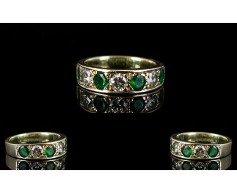 Ladies 9ct White Gold Attractive 7 Stone Emerald and Diamond Ring. The 3 Round Brilliant Cut Diamonds of Commercial White Col