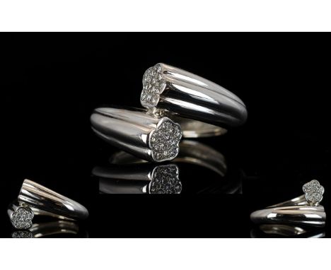 18ct White Gold Diamond Ring Of torque design, the terminals pave set with diamonds, weight, 10.45 grams
