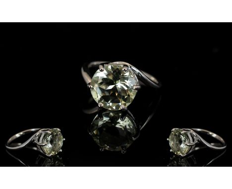 Green Amethyst Solitaire Ring, a round cut 5ct solitaire green amethyst in a six prong, crown style, setting, held between th