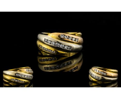 18ct Gold Continental Diamond Ring Comprising three rows of channel set brilliant cut diamonds. Continental marks to shank, w