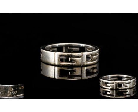 Gucci 18ct White Gold Ring Fully hallmarked 750, ring size N-O, the band formed of four pierced 'G' characters. Total weight,