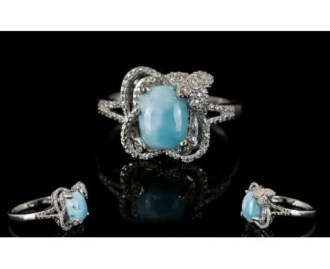 Larimar Solitaire Ring, a cushion cut larimar of 2.5cts set in a decorative milgrain mount with a flower enhanced claw holdin