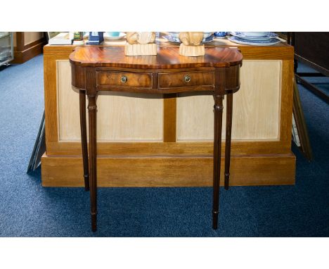 A Pair of Mahogany Console Tables - shaped fronts with two frieze drawers raised on turned, fluted supports. Height 28.5 inch