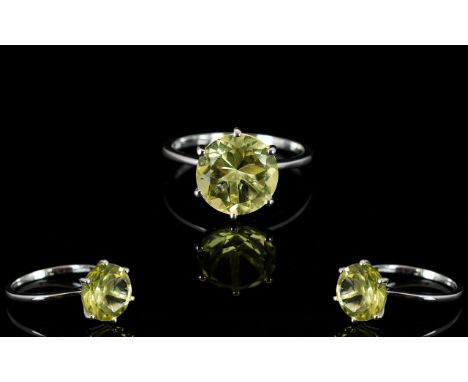 Lemon Quartz Solitaire Ring, a round cut lemon quartz, 11mm in diameter and of 4cts, set in a six prong 'Tiffany style' setti