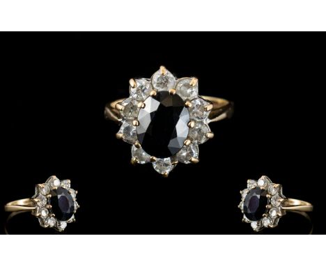 Ladies 9ct Gold Sapphire and CZ Set Cluster Ring, Flower head Setting. Full Hallmark for 9ct. Ring Size - N. 3.8 grams.