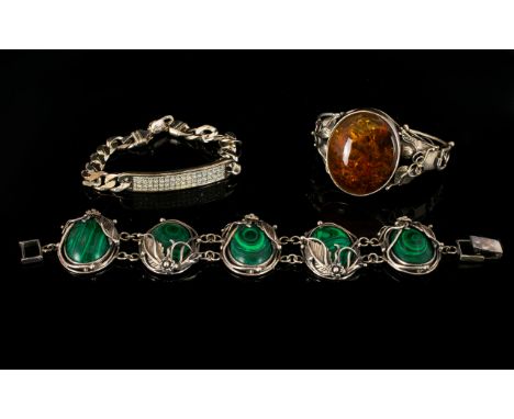 Silver And Malachite Set Bracelet Arts and crafts style statement bracelet comprising five oval malachite cabochons, each mou