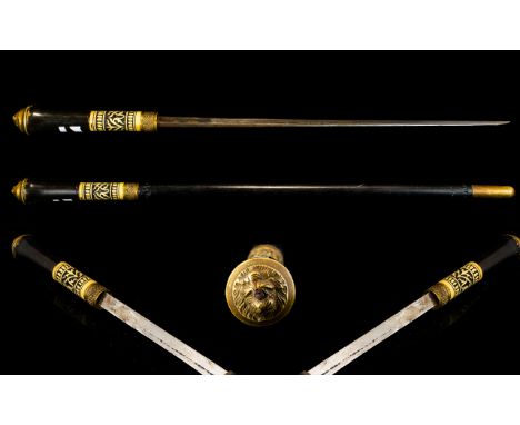 An Eastern Ebonised Sword Stick (Swagger Stick) The Carved Bone Handle With Lion Mask Terminus, Length 58cm. Please See Accom