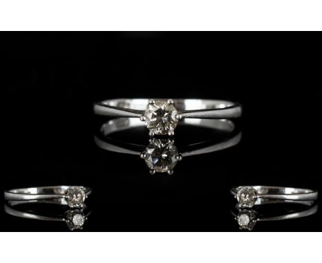 Platinum And Diamond Single Stone Ring Set with a round modern brilliant cut diamond, fully hallmarked, ring size L, 