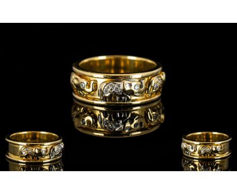 18ct Gold And Diamond Wedding Band The front with three Elephants encrusted with diamonds, hallmarked, ring size N 1/2, weigh