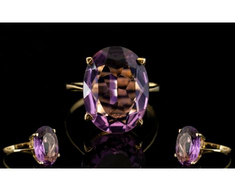 9ct Gold Single Stone Amethyst Set Dress Ring of Pleasing Form. The Large Faceted of Pleasing Colour. Est Weight 6.00 cts, Fu