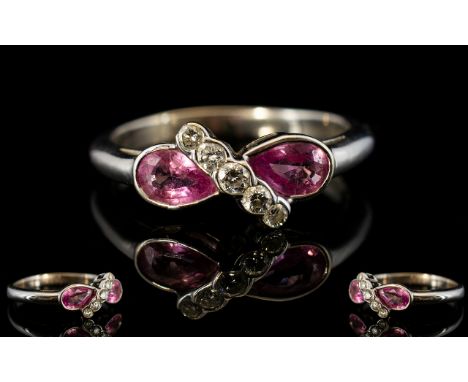 18ct White Gold Pink Sapphire And Diamond Ring Two pear shaped sapphires set between a row of brilliant cut graduating diamon