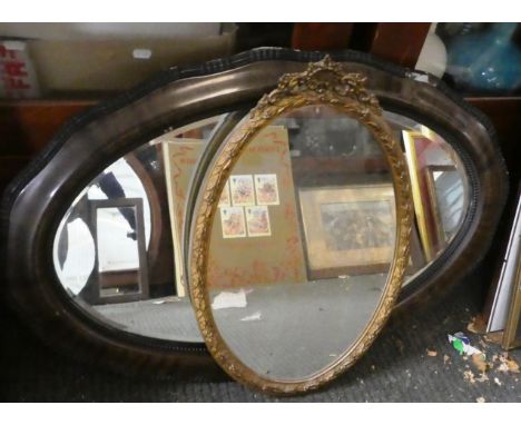 An Oval Gilt Framed Wall Mirror, 56cm high and an Edwardian Oval Cushion Framed Wall Mirror, 82cm Wide 