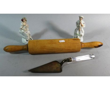 A Silver Plated Glass Handled Cake Slice by Lisa Mori, A Vintage Wooden Rolling Pin and Pair of Staffordshire Figures 