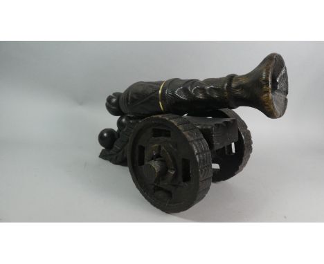 A Large Carved Wooden Model of a Spanish Cannon and Cannon Balls , 44cm Wide 
