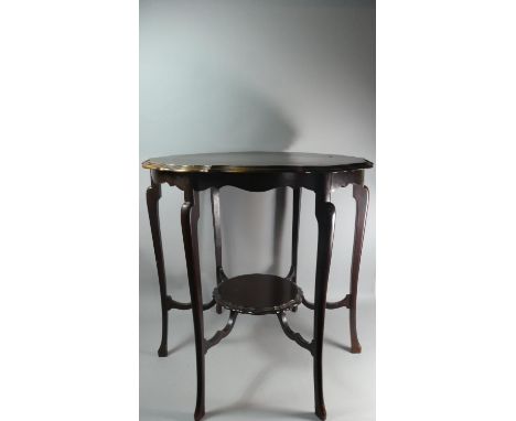 An Edwardian Mahogany Shaped Circular Occasional Table with Stretcher Shelf, 72cm Diameter 