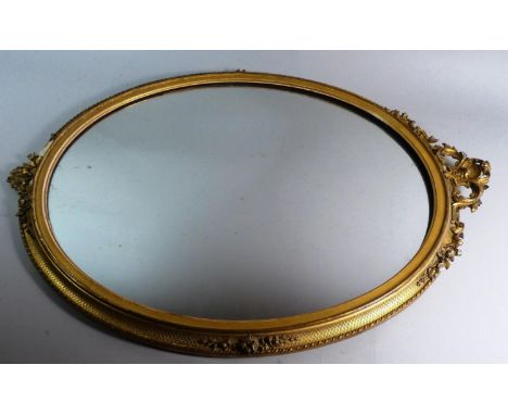 An Oval Gilt Framed Wall Mirror, Minor Losses to Frame, 73cm High 