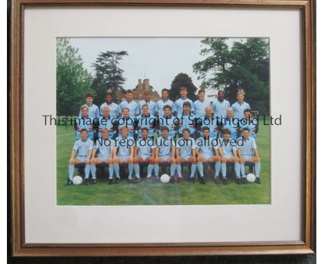 ENGLAND FOOTBALL       A 9" X 7" framed and glazed colour team group in light blue kit in 1987/8 season at Bisham Abbey, take