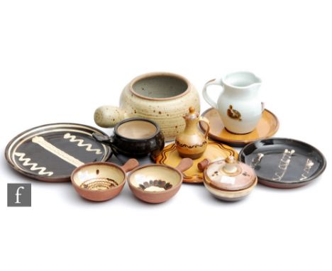 A collection of assorted mid to late 20th Century Winchcombe Pottery to include dish stands, a jug and a vinegar bottle, each