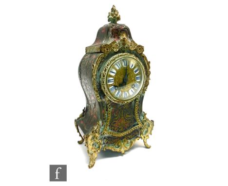 A French 19th Century Boulle work eight-day mantle clock, the gilt dial with white enamelled Roman numerals, and gilt inlaid 