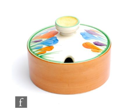 A Clarice Cliff Bon Jour shape shallow preserve pot circa 1936, hand painted to the cover with crocus sprays with yellow, gre