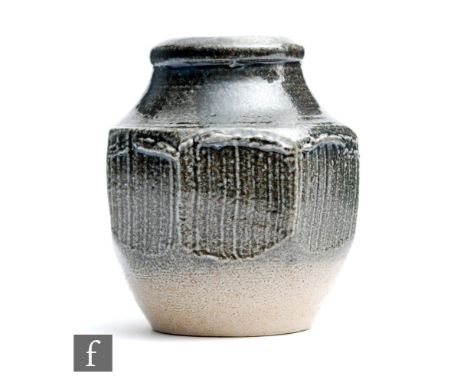 A small Winchcombe Pottery vase thrown and decorated by Ray Finch, the faceted body with a oxide glaze, impressed seal mark, 