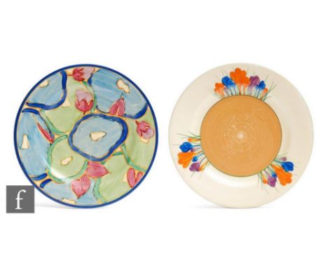 A Clarice Cliff circular side plate circa 1931, hand painted in the Blue Chintz pattern with stylised flowers and foliage in 