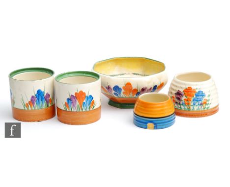 A small group of Clarice Cliff items to include a Crocus pattern Ivor bowl, two Crocus pattern drum preserve bases, a Crocus 