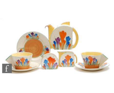 A Clarice Cliff Stamford early morning breakfast service circa 1930, hand painted in the Crocus pattern with crocus sprays wi